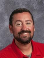 Headshot of Nick Laatsch wearing a read shirt.